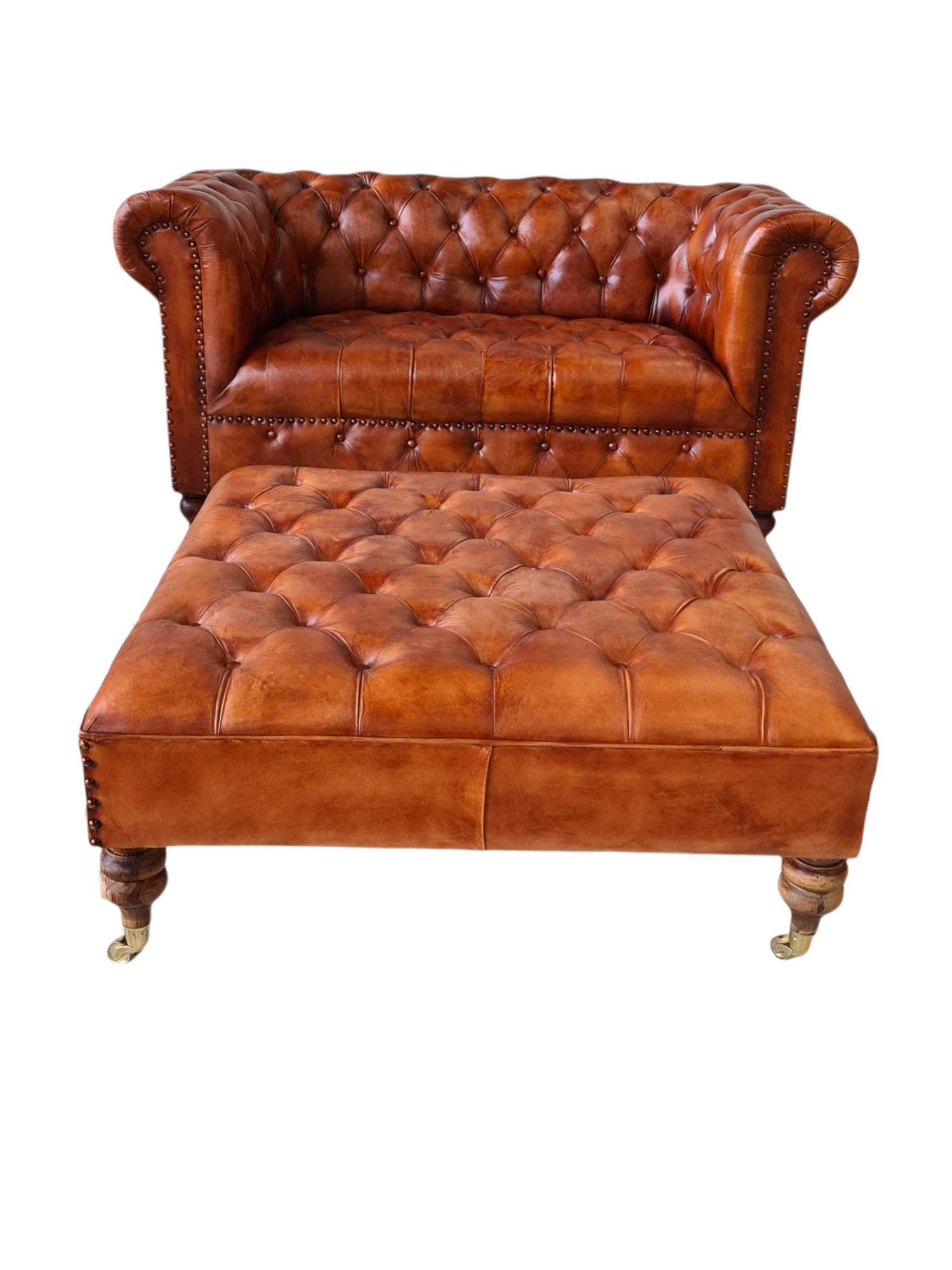 LINCOLN LEATHER OTTOMAN WITH BRASS WHEELS