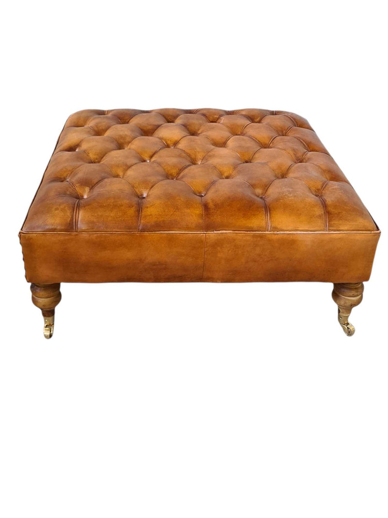 LINCOLN LEATHER OTTOMAN WITH BRASS WHEELS
