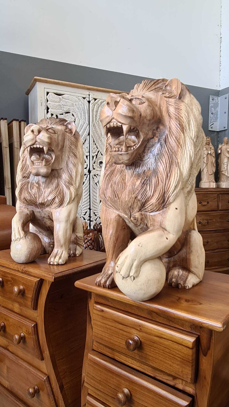 PAIR OF WOODEN LIONS